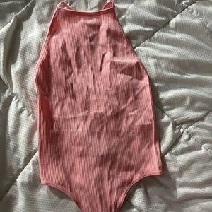 Woman’s small pink bodysuit